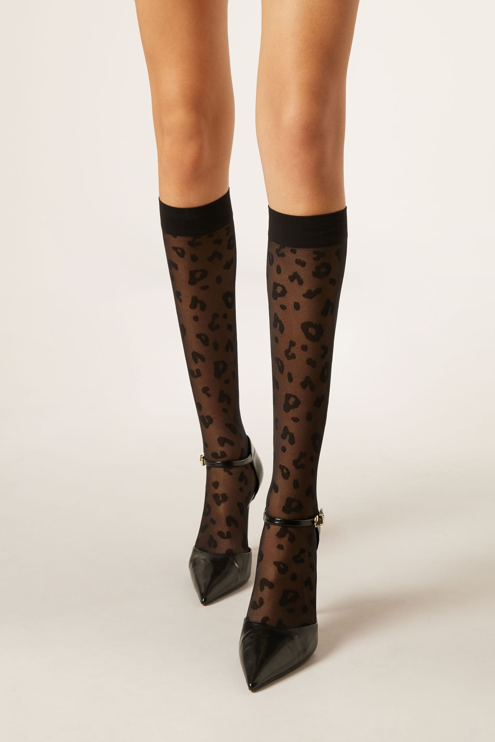 meia longa transparente com padrão animalier - preto